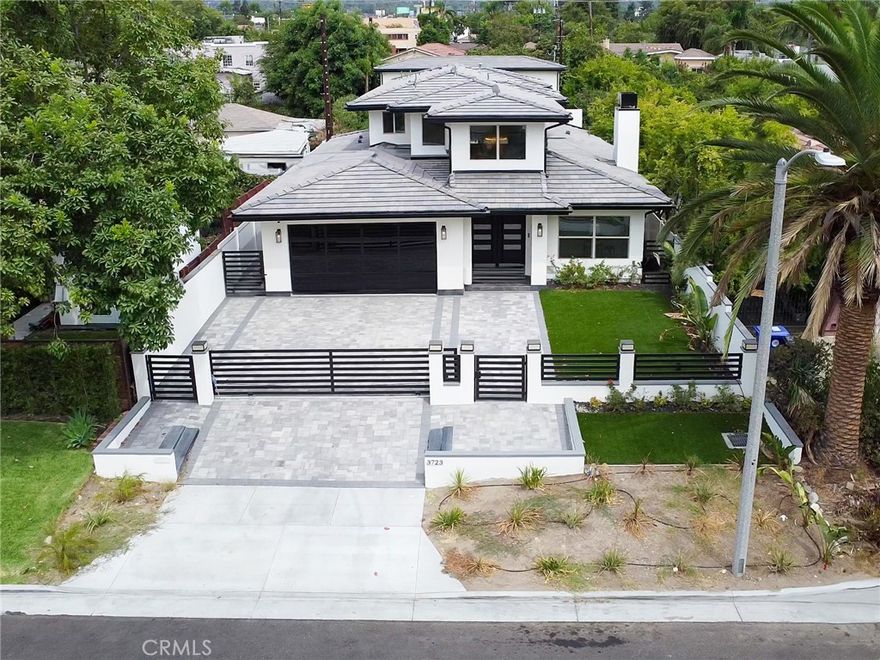 Brand-new construction in the desirable Michelinda Park neighborhood of East Pasadena featuring a spacious main residence plus a rare two-story detached ADU.



The main house offers approx. 3,500 sqft with 4 bedrooms and 5 bathrooms. The first floor includes a convenient guest bedroom, a private suite with its own full bath, and an additional powder room—perfect for visitors or multi-generational living. A dramatic double-height foyer with a modern chandelier opens to the light-filled living room with fireplace and the open dining area.



The gourmet kitchen showcases an oversized island, quartz countertops, custom cabinetry, and premium Thermador stainless-steel appliances, providing the perfect blend of elegance and functionality for both daily living and entertaining.



Upstairs, the luxurious primary suite features a spa-inspired bathroom, walk-in closet, and access to an expansive private balcony with stunning views of the mountains and lush greenery.



The newly built two-story ADU provides approx. 1,200 sqft with 3 bedrooms and 3 bathrooms, a full kitchen, living area, and its own private entrance—ideal for extended family, guests, or attractive rental income.



Additional highlights include a 3-car garage, designer finishes throughout, and a large yard with artificial turf for low-maintenance landscaping. Conveniently located near Santa Anita Mall, Santa Anita Race Track, parks, and with easy access to the 210 Freeway.