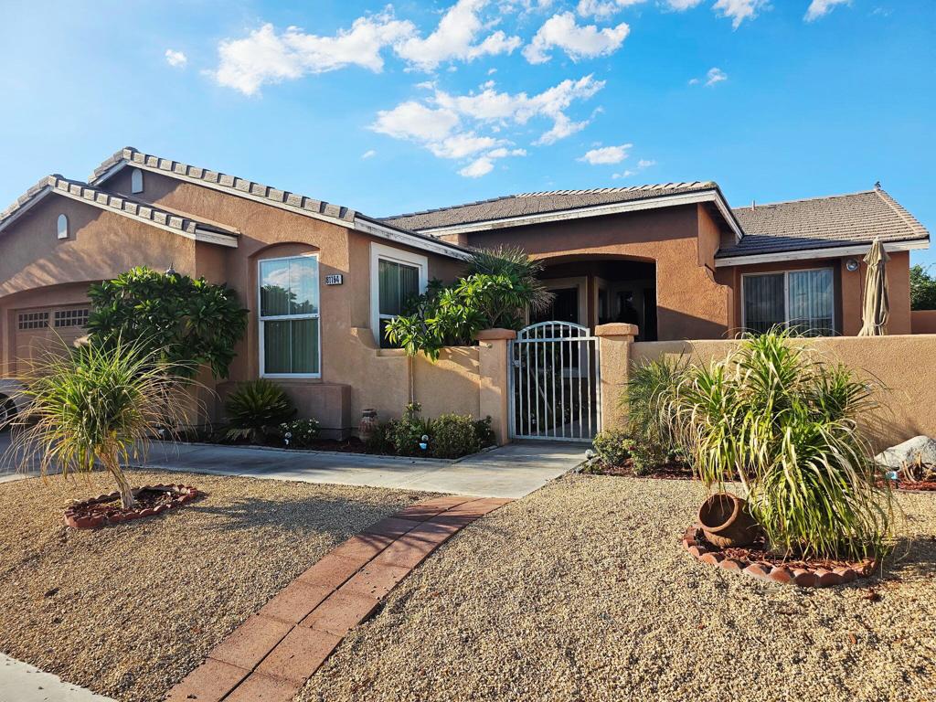 Gorgeous Home located in the Gated Community of Las Colinas w/low HOA! Just minutes away from I-10 Freeway and HWY 111. This Beautiful Property offers: private courtyard entry, 3 bedrooms with potential to add an extra bedroom & bath. 2 car garage, dining room, family room with fireplace, spacious kitchen with granite counter tops, pantry and breakfast bar. Tile flooring throughout the house. Large master bedroom with walk-in closet and direct access to the backyard. Master bathroom with dual sinks, walk-in tub and upgraded shower. Guest bathroom with dual sinks & upgraded shower. Big and relaxing backyard with fruit trees. Excellent location with close distance to The Coachella Fest Polo Fields, Tennis Garden, Casinos and the Acrisure Arena. Call today to schedule a tour of this amazing home.