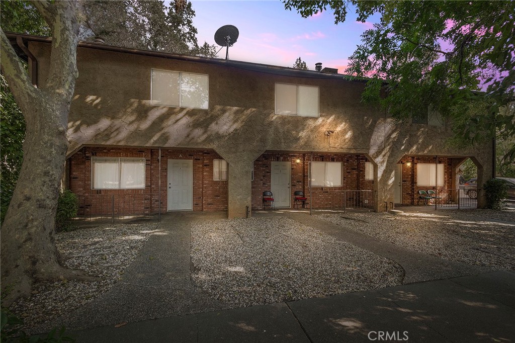 Premier Investment Opportunity! This beautifully updated tri-plex, situated near Downtown Chico, Chico State, shopping, and dining, features three 1,300 sqft townhouse-style units, each with 3 bedrooms and 3 bathrooms. Each unit showcases newer vinyl plank flooring, inviting living rooms with classic brick fireplaces, and modern kitchens equipped with white appliances, including newer dishwashers, gas stoves, ranges, refrigerators, and garbage disposals. Enjoy private fenced patios, ample storage, central heating and cooling, in-unit washers and dryers, and off-street parking. Professionally managed, this property is an ideal turnkey investment in a prime location.