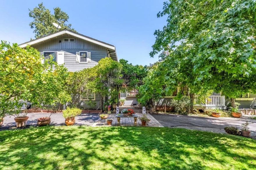 Welcome to an amazing estate property within walking distance of downtown Woodside.The gated front yard encloses a large lawn, a circular driveway, and beautiful mature trees that support the beautiful facade of this home. A wisteria laden court yard leads to a charming entry foyer with two large windows leading to the formal living room. The living room with its fireplace and coiffered ceiling makes for an intimate setting for formal gatherings. Walk-in to the family room and you are awestruck by the vaulted ceiling, clerestory windows, and so much volume! There is a nicely fitted dining area within the family room. The beautifully updated kitchen has Bosch appliances, quartz countertops and maple cabinetry. It spills out to a large deck for al fresco dining and entertaining.The large and luxurious primary suite is a delight. The primary bedroom has an attached balcony, his and hers walk-in closets and a spa-like bathroom. The primary bath includes a double vanity, a free standing tub and a large shower.The large backyard of this home is beautifully landscaped with so many thoughtful areas for lounging, playing, or planting.