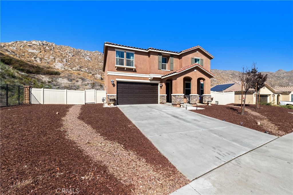 THIS HOME QUALIFIES FOR A $20,000 GRANT WHICH CAN BE USED FOR A DOWN PAYMENT AND/OR CLOSING COSTS! Welcome to your dream home at the end of a quiet cul-de-sac in the scenic hills of Stonecrest at the Cove—where stunning views, luxury upgrades, and a spacious layout come together on an oversized quarter of an acre lot with RV potential! This bright and inviting 4-bedroom, 2.5-bath 2529sq ft home offers an open-concept design, a main-floor guest suite, a generous loft, and a two-car garage with extra storage. Step inside to find 9-foot ceilings, recessed lighting, and luxury vinyl flooring throughout. The chef’s kitchen features dark wood cabinetry, quartz countertops, an oversized island with seating, and sleek sliding accordion doors that open to your private backyard—ideal for indoor-outdoor living. The primary suite is a peaceful retreat with an ensuite bathroom and a large walk-in closet. Enjoy a drought-tolerant front yard, a custom concrete patio in the backyard, and an extra-large side yard ready for RV parking or future expansion. Energy-efficient with solar power, dual-pane windows, and modern finishes, this home checks every box. Located just minutes from shopping, parks, and a local elementary school, you'll love the perfect blend of country charm and city convenience. Don’t miss your chance to live in one of the most desirable neighborhoods in the area!