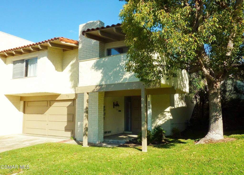 Great Townhome in Racquet Club Villas! Backing to a wide greenbelt, this desirable 3 bedroom home (one with an armoire, no closet) and 2 updated baths, also has a den with a sliding door that leads to the back patio. There is a newer kitchen with breakfast bar, a large balcony, with views, off the living room with decorative only fireplace, vaulted ceilings, ceiling fans, newer Nest thermostat, newer programmable garage door opener, roomy backyard with patio area and gate to greenbelt. Attached 2 car garage with direct access. End unit. Close to Thousand Oaks Mall, restaurants, stores and freeway. WELCOME HOME!