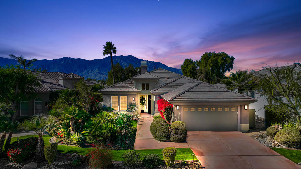 Beautiful, turn-key furnished home in the gated community of Mira Vista at Mission Hills. This former model home sits on one of the most premier lots, taking advantage of million door views from both inside and out. The Escondido floor plan offers 2,331 sf with 3 bedrooms, 2 bathrooms, great room with gorgeous furnishings and granite fireplace, custom wood coffered ceiling, and wet bar. The granite kitchen with island, nook, and breakfast bar has been updated with KitchenAid stainless steel appliances and espresso stained cabinetry, and opens to the great room. The rear yard offers a breath taking panoramic view of multiple golf course fairways, lakes and mountains, and goes on forever! The covered patio offers shade while the saltwater pool and spa maximize complete sun exposure.