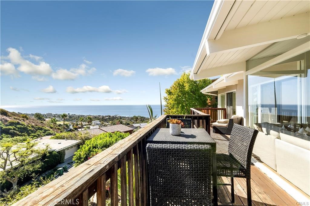1214 Anacapa presents a rare opportunity to own a home in Laguna Beach’s sought-after Mystic Hills neighborhood. Ideally positioned, it offers stunning views while remaining close to the beaches and the vibrant heart of town.
Step inside to find sun-filled interiors that create a warm, welcoming atmosphere. The main level features three bedrooms, a comfortable living area, a well-appointed kitchen, and direct access to the garage. Expansive decks extend from this level, perfect for taking in the panoramic vistas and enjoying the fresh ocean breeze.
The lower level offers a generous secondary living space that opens to a flat backyard—ideal for entertaining or play. This level also includes an additional bedroom and bathroom, making it perfect for guests or multi-generational living. With its versatile layout, the home accommodates a variety of lifestyles, and the main floor lives like a single-level home.
Set on a large parcel, there’s ample outdoor space with the potential to add a pool. This is a chance to create your dream coastal retreat in one of Laguna Beach’s most desirable neighborhoods—don’t let it pass you by!