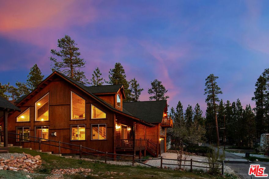 One of Big Bear Lake's most successful income-producing cabins, Cozy Bear Cabin is a proven short-term rental powerhouse with Superhost status and 40+ five-star reviews. This 3-bedroom plus loft, 2.5-bath log-style retreat offers over 2,600 sq ft of rustic elegance, just blocks from the lake, Alpine Slide, Big Bear Mountain Brewery, and only a mile from The Village.Step inside and you'll be greeted by abundant natural light pouring through skylights, highlighting the soaring 23-ft cathedral ceilings and grand stone fireplace in the expansive great room. The open chef's kitchen is designed for entertaining, featuring stainless steel appliances, a walk-in pantry, and a built-in wine cooler. The spa-inspired primary suite includes its own fireplace, private patio access, walk-in closet, and a jetted tub for the ultimate retreat. Upstairs, the entertainer's loft doubles as a game room and lounge, complete with pool table, TV area, kids' play nook, and even a retro Pac-Man arcade machine for endless fun. Two additional bedrooms each offer walk-in closets and private balconies to soak in Big Bear's crisp mountain air.Additional highlights include a tankless water heater, laundry room plus second washer/dryer in the garage, intercom and alarm system, and a 2-car garage. Offered fully furnished and turnkey, this property consistently ranks among the highest-rated 3+ bedroom cabins in Big Bear Lake.Whether you're searching for a mountain sanctuary, a vacation-ready family getaway, or a top-performing short-term rental investment, Cozy Bear Cabin delivers the perfect blend of comfort, lifestyle, and income potential.
