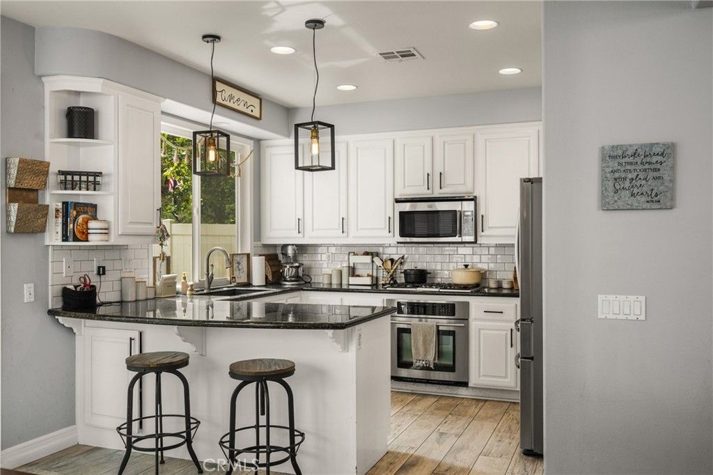 Photo of 8346 E Quiet Canyon Court, Anaheim, CA 92808 (MLS # PW26065835)