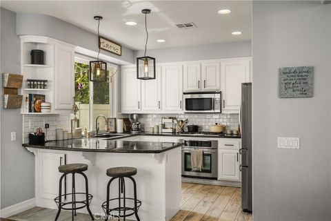 Photo of 8346 E Quiet Canyon Court, Anaheim, CA 92808 (MLS # PW26065835)