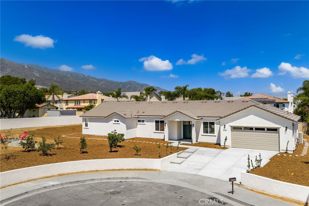 This Beautiful home was just built by "Tenaya Homes". This home is nestled at the end of a quite cul-de-sac in one of Alta Loma's most sought-after Neighborhoods, and as soon as you lay your eyes on it you'll recognize the attention paid in to every detail. Here are just a few of its many other fine Features: Drought tolerant landscaping, Durable tile roof, custom sectional garage door, and portico entry enhance its eye-catching curb appeal. Custom double doors open to a flowing 2,613 square foot open concept floor plan that is in " Pristine Condition" with recessed lighting and luxury vinyl flooring. The spacious living room is bathed in natural light and has direct patio access. The family's cook is going to truly appreciate the kitchens abundant cabinets, ample quartz counters with full tile back-splash, large center island with built in breakfast bar, deep basin stainless steel sink, built-in stainless steel appliances, gas range with stainless steel ventilation hood, and the convenience of the adjoining dining area with its custom pendant lighting and direct yard access. 5 bedrooms; the grand suite has a efficient lighted ceiling fan, large walk-in closet, and a sumptuously appointed bathroom with dual sink mirrored vanity, soaking tub, and glass enclosed shower. 3 bathrooms. Functionally located laundry room with handy utility sink and abundant storage. energy efficient dual pane windows will help keep your utility bills low and the interior very quiet. Central air and heat. your going to enjoy the huge wrap around yard with its covered entertainer's patio and out house thats connected to the sewer. Plenty of secure off street parking on the oversized concrete driveway and in the 2 car direct access garage. All of this sits on a huge 15,650 square foot lot that is close to schools, restaurants, grocery stores, Heritage community park and the 210 freeway. Call now for all the details and Ill gladly arrange your private tour.