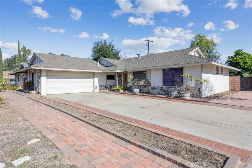 WELCOME TO YOUR NEW HOME**** SINGLE STORY, 4 bedrooms, 2 full bathrooms. Comfortable and functional floor plan. Spacious living room features a classic stone fire place and slider doors that lead to the large covered patio. Kitchen (updated in 2005)is open to the dining area and living room. Convenient direct access to the attached 2 car garage with laundry hookups.  Primary suite offers two large closets and an attached bathroom with a step in shower. The backyard is private and expansive with fruit trees... ideal for entertaining, playing or relaxing. Located on a quiet residential street. Corner lot. Close to schools, shopping and parks.  A sought after Glendora neighborhood.  Seller has kept up with normal maintenance. Repairs are mostly COSMETIC only. All carpeting has been removed to expose concrete floors. Ready for your personal touch!