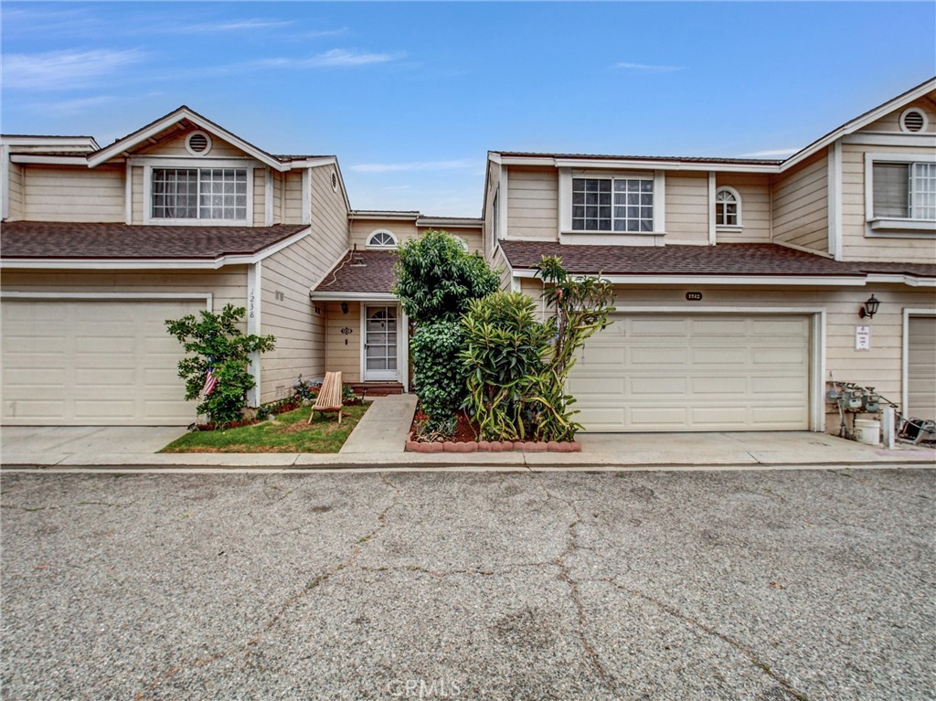 Welcome to 1242 Bayport Cir #28, Pomona – A Hidden Gem in Bayport Village gated Community! This charming 2-bedroom, 2.5 bathroom condo offers comfort, privacy, and an abundance of natural light. Home features TWO ENSUITE bedrooms, each with its own bathroom; an inviting open concept living space with high ceilings, a cozy fireplace, and a private patio. The kitchen features granite countertops, plenty of cabinet space, and a breakfast bar for casual dining. Enjoy in-unit laundry, central AC, and an attached 2-car garage for added convenience. Located in a quiet, well-maintained gated community with access to a sparkling pool and spa, this home is close to major freeways, Cal Poly Pomona, shopping center and the 10, 71, and 57 freeways.
