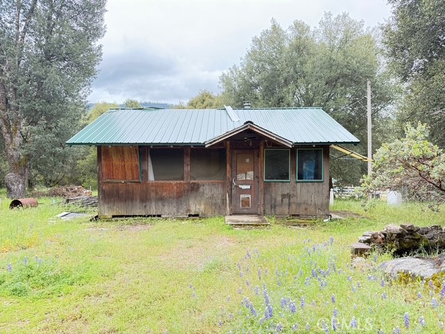 Calling All Investors!
This is a 500 sq ft cabin that already has approved plans and pulled permits to expand it to about 900 sq ft, 2 bed / 2 bath. The hard part dealing with the county is already done! This rustic cabin offers the perfect canvas for investors, flippers, or those looking to create a mountain retreat. Nestled in the scenic foothills of Oakhurst, the property features a charming wood exterior, vintage details, and a peaceful natural setting.
Inside, you'll find an open living area with wood paneling, a freestanding wood stove, and plenty of potential for a creative redesign. The kitchen and bathrooms are in need of full renovation, making this a true fixer-upper opportunity for those ready to bring their vision to life.
The property also includes outdoor space with mature trees, a detached outbuilding, and ample room to expand or reimagine. Close to Yosemite, Bass Lake, and Oakhurst amenities making it a perfect opportunity for an Airbnb. Endless potential to renovate or rebuild.
Sold AS IS - Seller will not make repairs
Don't miss your chance to transform this diamond in the rough into your next profitable project or cozy getaway!