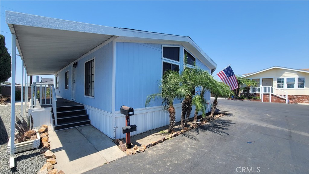 Welcome to space 235 S. Beach Blvd #78! This 3 bedroom, 2 bath manufactured home features a large family room, kitchen and dining area, 2 baths with a large corner soaking tub, central air conditioning, laundry room, covered patio and exterior storage shed! This corner unit is easy to access, has only 1 direct in-park neighbor and will not last long! Have you been looking for a senior (55+) mobile home park which values serenity and peace of mind? Then this may be the park for you! This 173 unit complex is resident member owned and comes with an Occupancy Agreement which provides you with the exclusive right to your home space with no monthly site rent! There is a one-time membership stock purchase of $30,000 payable to the association prior to close of escrow which is not included in the purchase price. 1 monthly HOA fee of $250 and capital improvement monthly fee of $292 for 10 years provides you with peace of mind living for only $542 a month! The roof was installed in February 2024.