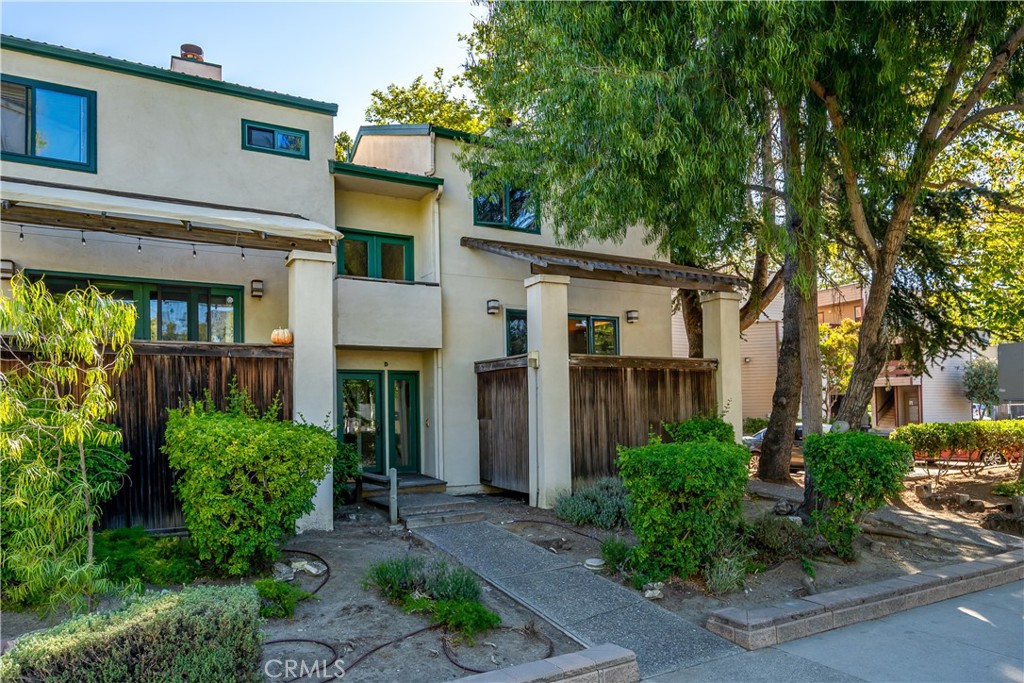 Welcome to this updated 2 bedroom and 2 1/2 bath DOWNTOWN condo with an office, indoor laundry and a large bonus room off the garage. With approx. 1510sf, this beautiful home features easy care laminate flooring in the main living areas and upper office, a gas fireplace in the expansive living room with attached deck, indoor laundry and large storage room located at the rear of the attached two car garage. The Tesla car charger is an added bonus! The dining area opens to the updated kitchen and living room. There are two primary bedrooms with ensuite full baths upstairs and a half bath on the main level. The living room boasts a Tray ceiling with indirect lighting and sliding glass doors opening onto an inviting view deck allowing for easy indoor-outdoor living. The bonus room/office is located on upper level. Designed by architect, Barry Williams, this is end-unit Downtown, Rustic Gardens condo is close to restaurants, shopping and more. Information not verified.