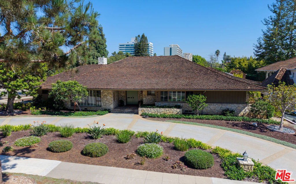 This is an amazing opportunity to develop your dream home on one of the best tree-lined streets in the Flats of Beverly Hills. The current existing property is over 4,000sf featuring five bedrooms & five baths on a huge 20,500sf lot with a circular driveway and a detached 3-car garage. The house features a formal Living Room, Dining Room, Family Room w/bar, a large Chef's eat-in Kitchen with a center island and a separate laundry room. You will get the best in So-Cal living with indoor/outdoor flow into a gorgeous manicured rear yard, outdoor built-in grill and a sparkling pool. Bring your toothbrush or your designer, architect or contractor.........this opportunity won't last long!!