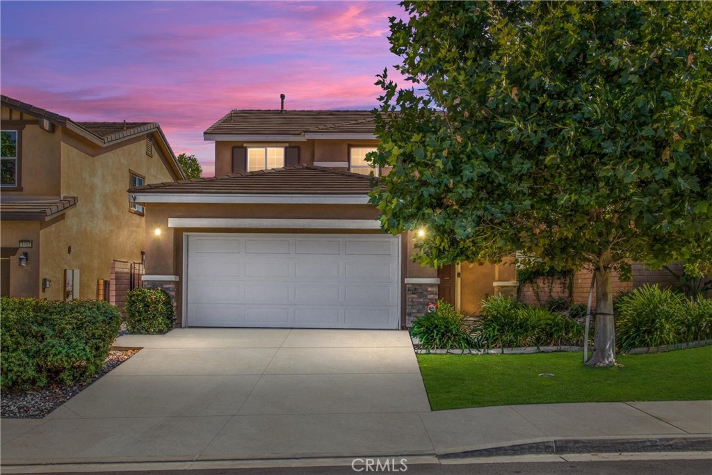 Step into the sought-after Rosena Ranch community—where comfort meets convenience and every room comes with a view. This move-in-ready gem blends the charm of a well-kept modern home with the perks of a vibrant neighborhood full of amenities. Inside, you’ll find an airy open-concept layout with abundant natural light, a cozy gas fireplace with custom mantle, and thoughtful built-ins ready for your personal touch. The kitchen makes everyday living easy, with sleek granite countertops, a smartly angled island with breakfast bar, and plenty of storage space to keep everything within reach. Upstairs, three tranquil bedrooms await, including a primary suite with dual closets and an en suite bathroom housing double vanities. The downstairs laundry room adds function with storage cabinets and a valet rod. Outside, relax in an intimate back yard featuring lush landscaping and shaded by alumawood patio cover and surrounded by vinyl fencing/block wall. This home comes loaded with modern convenience, including ceiling fans/fixtures and recessed lighting, a brand-new tankless water heater, solar panels and dual-pane windows throughout for energy efficiency, and rainbird irrigation system for low-maintenance living. Enjoy access to a Jr. Olympic lap pool, beach-entry pool, splash pad, clubhouse with fitness center and yoga studio, sports park, trails, BBQ areas, and more. All just minutes from city conveniences—yet tucked peacefully into the hillside. Mountain views. Turnkey convenience. Community lifestyle. Your Rosena Ranch retreat is ready—are you?