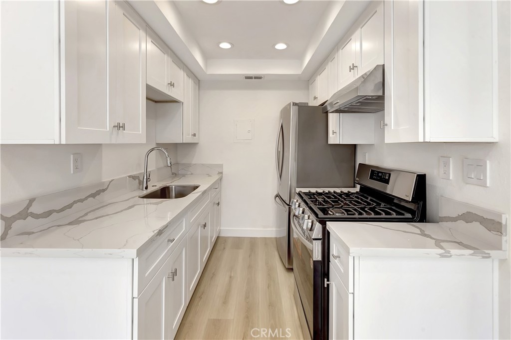 Newly renovated upper 3bd 1bth unit. ALL NEW interior with white kitchen cabinets, quartz counters, new windows, recessed lighting, and vinyl flooring. This condo shows like a 10. Great for a first time owner occupant or excellent rental property. Rentals in this neighborhood have extremely low vacancy factor.
