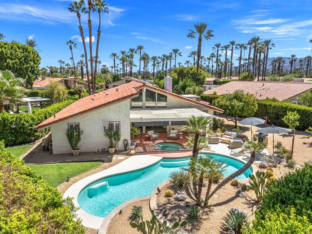 What a beauty! This spacious and very stylish 3 bedroom, 2 1/2 bath pool home in the gated community of Presidential Estates is an absolute steal!Upon arrival, you will enter a private and charming gated courtyard with low maintenance but mature landscape to sit out and enjoy your morning coffee.The formal grand entry welcomes you into a bright living room with soaring ceilings, cozy fireplace, newly installed luxury vinyl plank flooring and baseboards, custom arches, arched bar, and amazing views of your backyard.The spacious kitchen features granite countertops, a gas cooktop, and a beautiful enclosed atrium adjacent to the formal dining room. On the north wing, the primary suite opens to the backyard and includes a walk-in glass shower with stylish tile, a separate tub, and large custom wood vanity. Two additional large guest rooms share a Jack and Jill bathroom and Boho-styled powder bath for your guests.Additional highlights include a laundry area, AC units about 4 years old, solar for excellent energy savings, and a two-car garage with golf cart space great for projects or storage. Presidential Estates offers a low monthly HOA with a community pool and spa, clubhouse, and tennis courts for residents to enjoy.Perfectly positioned on one of the largest lots in the neighborhood, this property features a sparkling pool, a park-like backyard with multiple entertaining areas, a side yard with fruit trees, and mountain views. Whether hosting large gatherings or enjoying a quiet retreat, this home offers it all.
