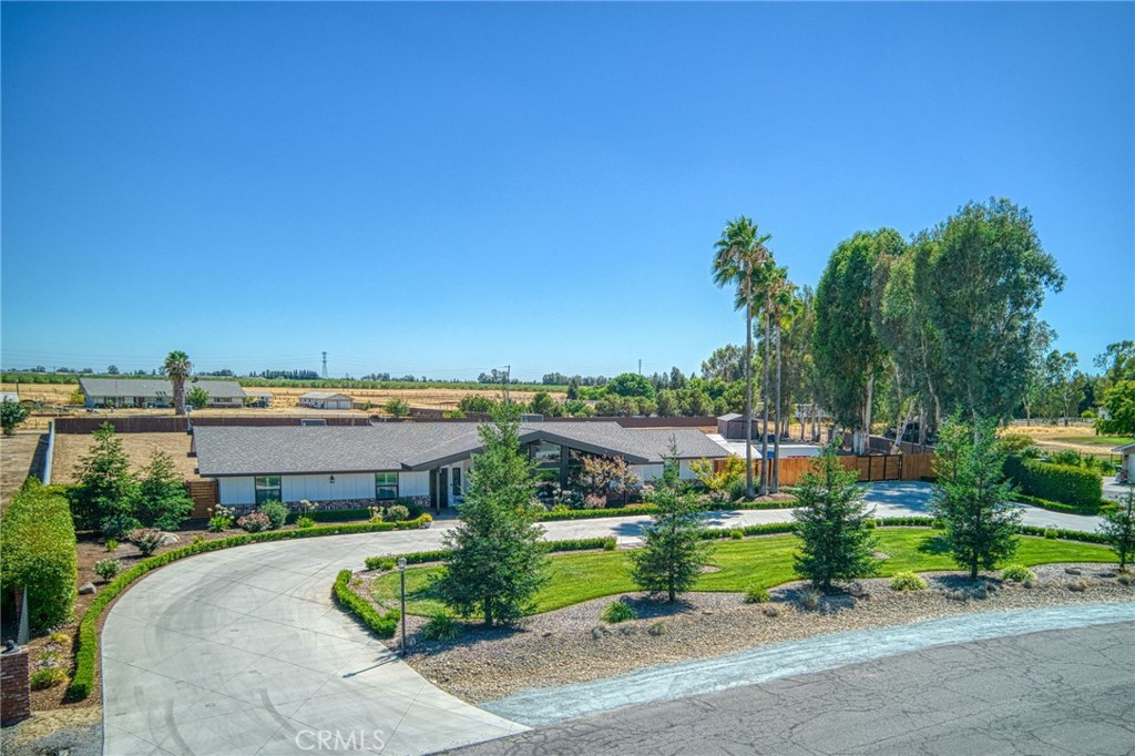 Set on approx. 2.09 acres in a peaceful Clovis neighborhood, this 4-bedroom, 3-bath home offers a spacious, functional layout with major system upgrades already in place. Inside, you'll find two living rooms, a formal dining room, and a kitchen that opens to the family room. Recent improvements include a new roof (2018), a new well with a new pump (2018), and two oversized HVAC units (2018/16 SEER). All duct work, insulation, and the electrical panel were also replaced.
The home features new windows completed in 2024, owned solar with no true-up history, a new whole house fan, automatic blinds, and new carpet throughout. The circular driveway was fully redone with reinforced concrete on one side to support heavy trucks. Exterior upgrades include two new garage doors (2025), a new fence and gate (2025), fresh front landscaping (2020), and exterior paint (2024). A detached shed provides additional storage. This turnkey property blends comfort, efficiency, and usable space in a highly desirable Clovis setting.