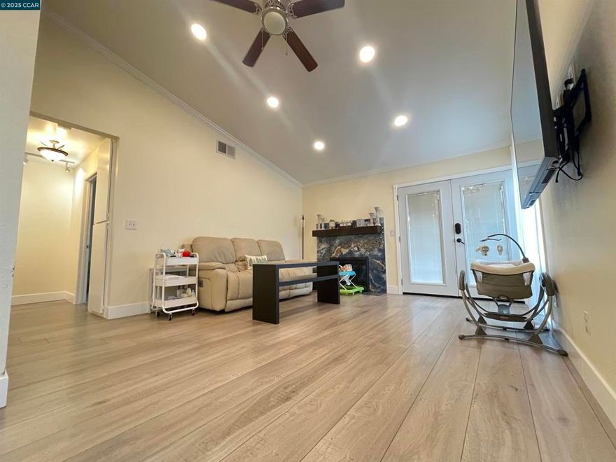 Natural light fills this functional, well-designed home in ViewPointe Rodeo. The spacious living room features vaulted ceilings and a cozy fireplace, creating an inviting atmosphere from the moment you enter. A fully enclosed atrium adds valuable additional space and enhances the home’s functionality, while the skylights truly are the cherry on top, brightening the home throughout the day. The open-concept kitchen seamlessly connects to the dining area, perfect for everyday living and entertaining. The owner’s suite offers direct access to the back patio, creating a private retreat. Two additional well-sized bedrooms also feature patio doors, providing great indoor-outdoor flow and added convenience. Additional upgrades include a newer electrical panel, recessed lighting, and a brand-new water heater. The low-maintenance yard allows you to enjoy the outdoor space without the upkeep, perfect for a busy lifestyle. Move right in and add your own personal touches. Just a few steps from the park and conveniently close to major freeways, this home offers both comfort and accessibility.