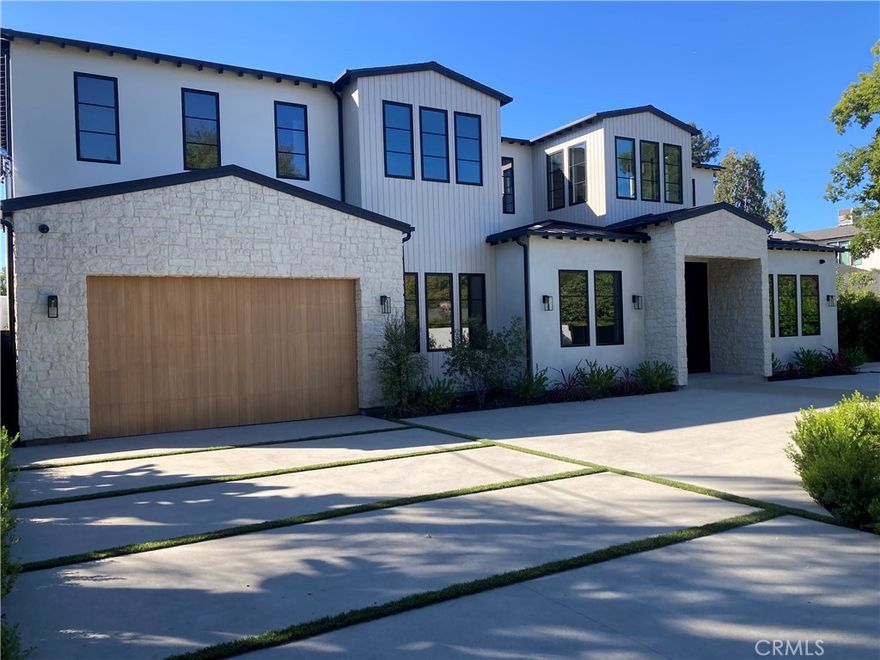 Welcome to this exquisite custom-gated estate, just completed and situated in the prestigious Walnut Acres community of Woodland Hills, CA. Nestled on a tranquil, quiet, and desirable street, this luxurious property offers a total living area of 6,418 square feet. It features a primary residence of 5,369 square feet, an 830-square-foot guest house, and a 219-square-foot gym.



The estate features six spacious bedrooms, each with its own en-suite bathroom, as well as a guest bathroom located downstairs. Exceptional amenities include a sports court/pickleball court, a pool, a jacuzzi, a sauna, and an outdoor covered barbecue area. Inside, you will find a state-of-the-art theater room and convenient laundry facilities on both levels.



Set on an expansive 18,338-square-foot flat lot, this property presents a rare opportunity to own a home in one of Woodland Hills' most sought-after neighborhoods.