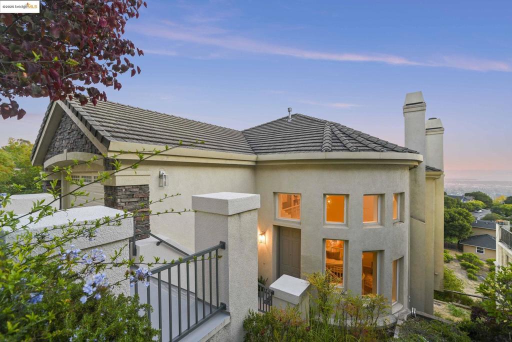 This 4 bdrm 3 bath 2942 sq ft home features tall soaring ceilings with beautiful Bay views, in Oakland’s Crestmont neighborhood, located in the boutique HOA community of Alta Villa - rarely available! Built in 2003, this expansive contemporary design home boasts a formal living room, separate family room, large dining room and secondary dining area with incredible views in the morning all the way until sunset! The kitchen offers endless storage including a walk in pantry, fresh quartz stone countertops, stainless steel appliances and awesome San Francisco and Oakland views. The attached two car garage provides interior garage access to the upper level where the primary bdrm, with ensuite bath and walk-in closet, and additional bdrms and full bath are. The fourth bdrm and full bath are conveniently located on the lower level, perfect for a visiting guest or home office. Comfort is maximized with dual-zone air conditioning and heating systems, as well as a fire sprinkler system. Sitting on a generous 5,063-square-foot lot, 661 Via Rialto shines bright! Views: Downtown