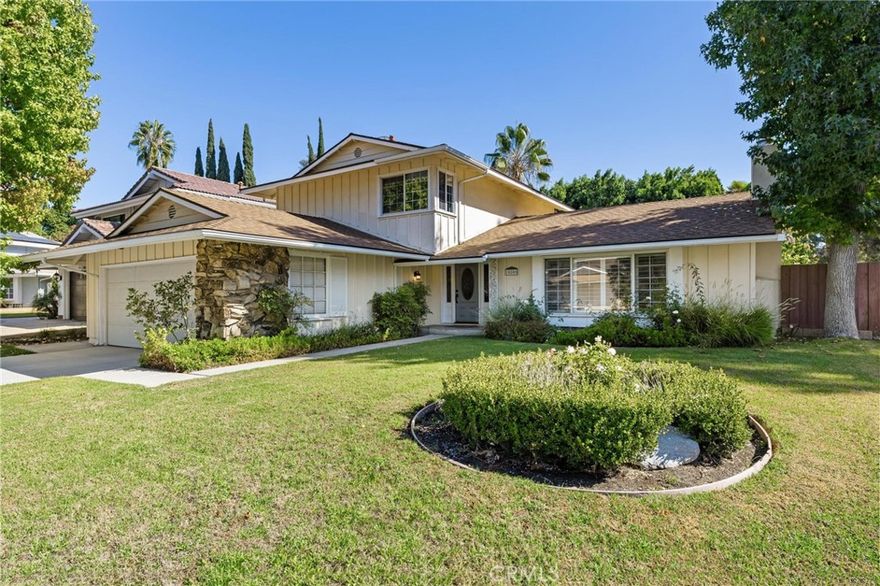 Welcome to 10800 Bismarck Avenue, a beautiful 4-bedroom, two-story pool home ideally situated on a desirable corner lot in the heart of Porter Ranch. This inviting residence offers comfort, convenience, and modern updates throughout. The spacious living room features a cozy fireplace, built-in book shelves, plantation shutters and abundant natural light, creating a warm and welcoming atmosphere. The updated eat-in kitchen includes stylish finishes, plenty of cabinet space, and a sliding door that opens directly to the backyard and sparkling pool—perfect for entertaining or relaxing outdoors. A separate den provides added flexibility as a home office, playroom, or media space. The primary suite is conveniently located on the first floor and offers privacy and ease of access, while the secondary bedrooms upstairs provide plenty of space for family or guests. Recent upgrades include a newer roof, new A/C system, and tankless water heater. The home also features leased solar for energy efficiency and a two-car garage for added convenience. Located within the highly rated Beckford Elementary, Nobel Charter Middle School, and Granada Hills Charter High School boundaries, this property also enjoys close proximity to premier dining, shopping, and entertainment at The Vineyards at Porter Ranch. A wonderful opportunity to enjoy the best of Porter Ranch living—comfort, convenience, and community—all in one beautiful home.