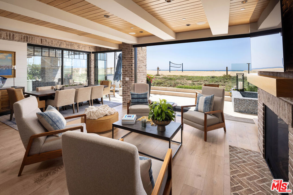 Introducing 1706 E Oceanfront, a luxurious beachfront oasis in Newport Beach, CA. With stunning views of the Pacific Ocean and a prime location near The Wedge and Newport Harbor. This state-of-the-art home offers the ultimate coastal living experience. Featuring 5 bedrooms, 6 full bathrooms, and 2 half bathrooms, this spacious property ensures comfort for both residents and guests. The oversized lot provides privacy, with no public boardwalk in front. Enjoy panoramic views of Catalina Island, Emerald Bay, Laguna Beach, and the Fashion Island Newport Center Skyline. This new construction masterpiece, completed in July 2019, boasts impeccable architecture by Sinclair Associates. The seamless indoor/outdoor living spaces, created by custom steel windows and sliding panel/pocket doors handcrafted by Riviera Bronze, perfectly capture the coastal ambiance. Inside, you'll find exquisite architectural millwork, custom mahogany solid panel interior doors, and smart home automation for convenience.With remote-controlled shades, French Oak flooring, and a luxurious three- story skylit stairway, this home exudes elegance and includes an elevator for easy accessibility. Not to mention, a limestone patio offers direct beach access for the ultimate beachfront lifestyle.