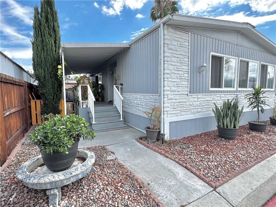 FULLY REMODELED HOME IN A LOW SPACE RENT, ALL-AGE COMMUNITY - YOU WILL LOVE THE MODERN UPGRADES! 3 Bedrooms | 2 Bathroom | Large 1440 Sq Ft Corner Unit is Perfect for the Whole Family! BEAUTIFUL Chef’s Dream Kitchen with Modern Countertops and Lots of Storage Space! Open Style Living Room and NEW Modern Style Flooring Throughout Home! All The Bedrooms are Spacious! Includes a Separate Den - Great for Home Office or Playroom! UPGRADED Bathrooms! Enjoy Relaxing Afternoons on the Covered Porch! Backyard is Perfect for Carne Asada! Convenient Parking for 3 Cars! Community Residents have Access to Sparkling Pool and Clubhouse! Great Location with Close Proximity to 15 and 91 Freeways!