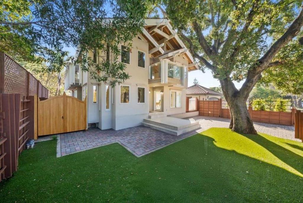 Incredible estate with three separate structures totaling over 5500 square feet an amazing price per square foot value for the extremely competitive central Palo Alto housing market. Boasting a convenient and central location just a short stroll to Stanford, Town and Country shopping center, Downtown Palo Alto, local area schools and much more! Lovingly and meticulously built by the architect-owner for his family, the home feels private and quiet once you are on the lot or inside. In the front of the home, a gorgeous mature City of Palo Alto heritage Oak Tree greets you. The spacious long and deep lot is fully paved with pavers with a lush yard in the back. Note: Some photos have been digitally enhanced to add grass areas where pavers currently are. This special home has extensive possibilities: a family estate (potential for grandparents, grown children, au pair units etc), a highly functional work and live space, or a unique set-up for local Stanford or Castilleja School students. The house features vaulted ceilings, light-drenched interiors, oak flooring throughout, Andersen windows and doors, window skylights, and the potential for an elevator to be added. Ample on-site parking for visitors in front of and behind the main gate. You can't miss it!