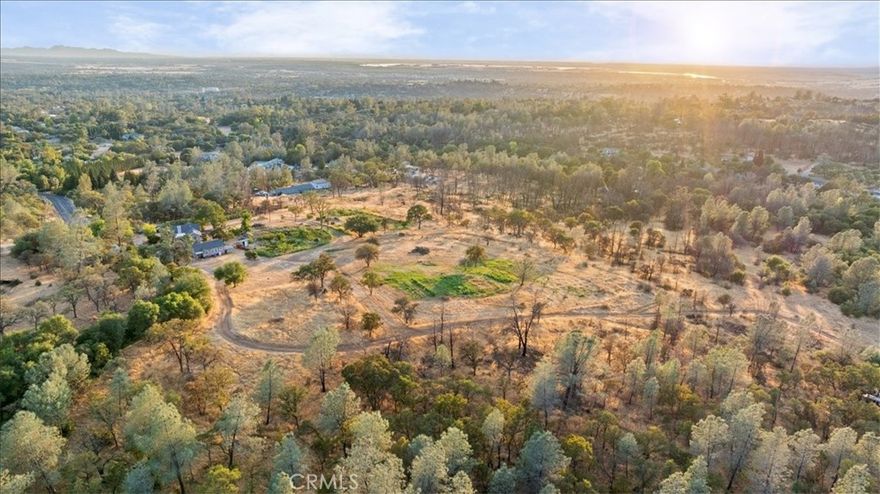 Here’s your chance to own 27 acres in a highly desirable area with incredible views of the Oroville Dam, Table Mountain, and the valley. Properties of this size and location are rare! The land stretches from Almond all the way down to Canyon Drive and is within riding distance of both horse and bike trails. The main home offers 2 bedrooms and 1.5 bathrooms, a spacious living room, tile flooring throughout, dual-pane windows, and mini-splits for year-round comfort. The kitchen is complete with granite countertops, ample cabinet and counter space, plus a walk-in pantry/laundry room. The second unit includes 1 bedroom, 1 bathroom, a kitchen, and a cozy living room with a freestanding stove. This one-of-a-kind property combines usable land, breathtaking views, and versatile living options.
