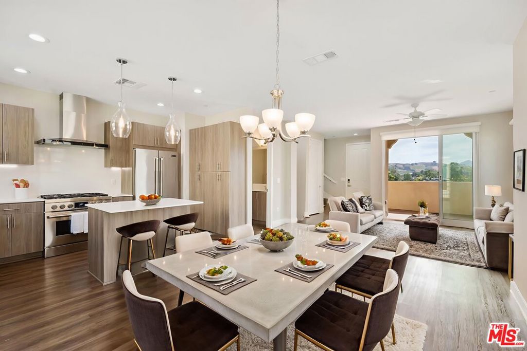 Welcome home to this stunning tri-level luxury townhome at the Paxton Calabasas! This lovely "Belmont" model is move in ready! This beautiful 2-bedroom, 2.5-bath townhome offers the perfect blend of comfort, style, and convenience across three well designed levels. Whether you're a professional, a student, a small family or anyone in between, this thoughtfully designed townhome provides everything you need. Features include two full bedrooms on the top level, both with attached bathrooms and generous closet space. The primary bedroom features a bright bathroom with dual sinks, soaking tub with a separate full shower and an attached private balcony, with views. On the main floor, enjoy the contemporary kitchen, equipped with an island, beautiful pendant lights, stainless steel refrigerator, quartz countertops, oversized six burner gas stove top and oven. Also on the main floor, an open dining area and family room that includes 8 foot high sliding glass doors that open fully to access wonderful fresh air on the patio. Step to the bottom level and you will find the full size laundry room that features a smart washer and full size dryer, a generous bonus/ flex space with direct access to the attached 2 car garage. The garage offers a 220 volt charger. Cool off in the community pool, work out in the gym and relax in the clubhouse. Centrally located with close proximity to Malibu, Calabasas Commons, Erewhon, Westlake Promenade, less than an hour to Los Angeles, dining options, market, parks, top rated schools and Pepperdine University. * images with furniture are virtually staged and are of a similar unit. *Move in bonus offered to tenants who sign a year plus lease- call for details,