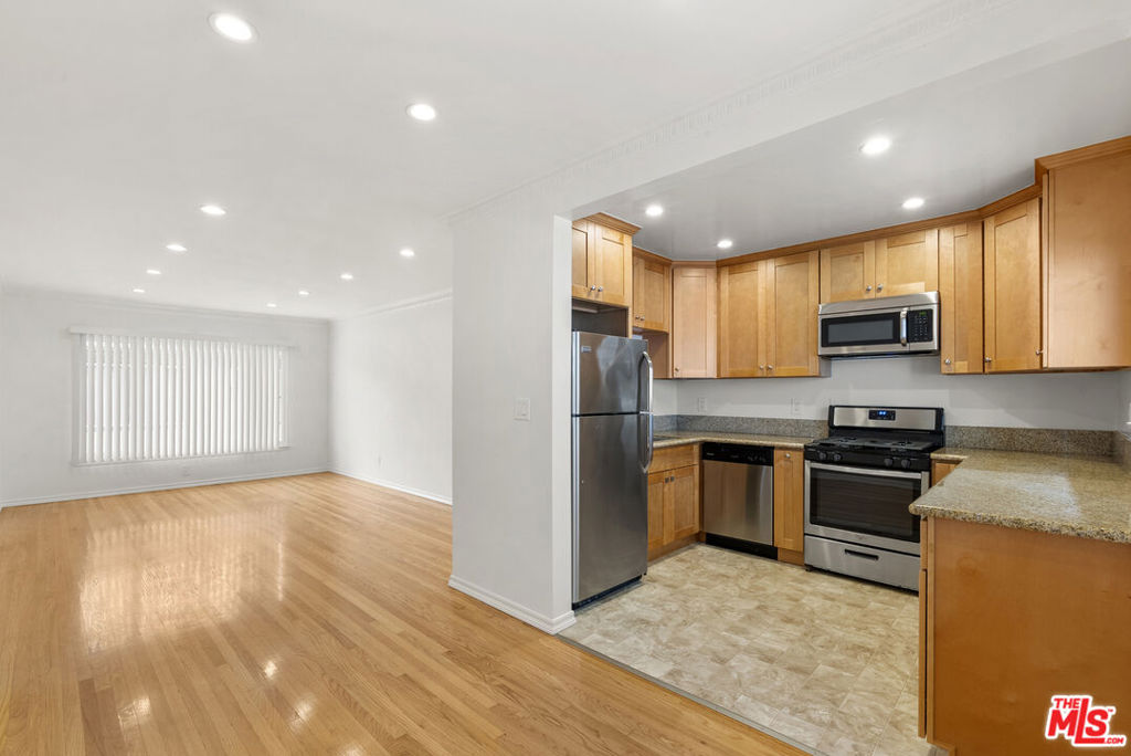 Top floor one bedroom, one bathroom apartment and prime West Hollywood location. The unit features hardwood floors throughout dimmable, LED lighting, ample storage space, Chef's kitchen, granite countertops, stainless steel appliances, including refrigerator, gas stove/oven dishwasher and microwave. Air conditioning in both living space and bedroom, newly outfitted bathroom with walk-in shower, built-in cabinetry and marble stone finishes. The building amenities feature a central courtyard, lounge area as well as a pool. Laundry and building amenities are shared. One dedicated parking space. In close proximity to some of West Hollywood's finest in dining, design, entertainment, Parks and recreation, and transportation.