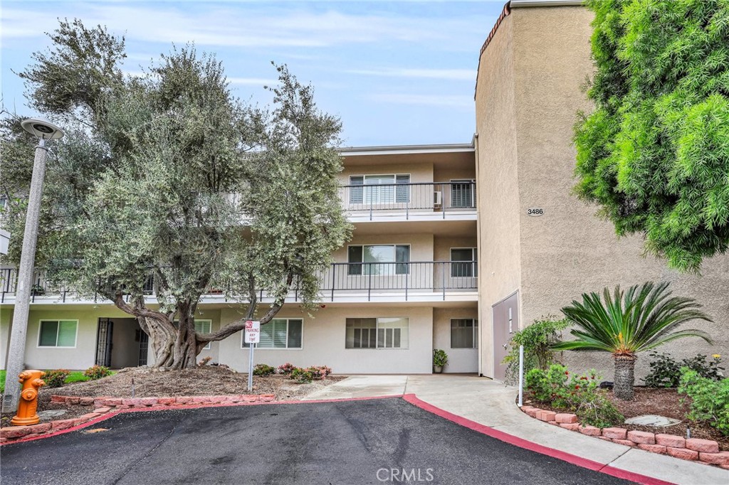 Enjoy the cooling breezes and fabulous views from this spacious top floor unit! Located on a gentle sloping hill on a private cul de sac location! This lovely unit has a large master suite and a powder room. Private gated entrance to unit on 3rd floor. Large living room/dining room combination with balcony access. Convenient to both laundry and assigned carport. Located in the fabulous age 55+ community of Laguna Woods Village. As a resident you will be able to enjoy 7 clubhouses, 5 swimming pools, private community golf courses (27 hole championship course and 9-hole par executive courses),tennis courts,lawn bowling greens,shuffleboard courts,craft and hobby workshops,garden centers, game rooms, billiard rooms, gym, horse stables, a very active theater and arts community, and library. Over 200 social clubs to join. This is all within a beautifully landscaped, gate-guarded golf community convenient to freeways, shopping, restaurants, outstanding medical facilities and of course, the beach. This unit is not a co-op unit, it is titled and has its own APN number.
