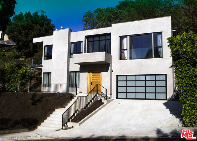 Striking newer construction of elegant contemporary design. Walls of glass sliding doors lead out to a sparkling pool from the huge open plan living room, ideal for entertaining and family gatherings. Open plan kitchen with sliding glass doors leading to the large side garden and outdoor BBQ built in area. 4 bedrooms suites upstairs, the master with a balcony looking out to the pool. A stunning bright luxurious home. Ideal location , easy access to the studios, a few minutes from trendy restaurants/shops on Ventura blvd, Fryman Canyon hike in the hills, and over the hill a short drive to the heart of Sunset blvd and Hollywood night life. Resort style living in the city. Pictures were taken before landscaping was complete.