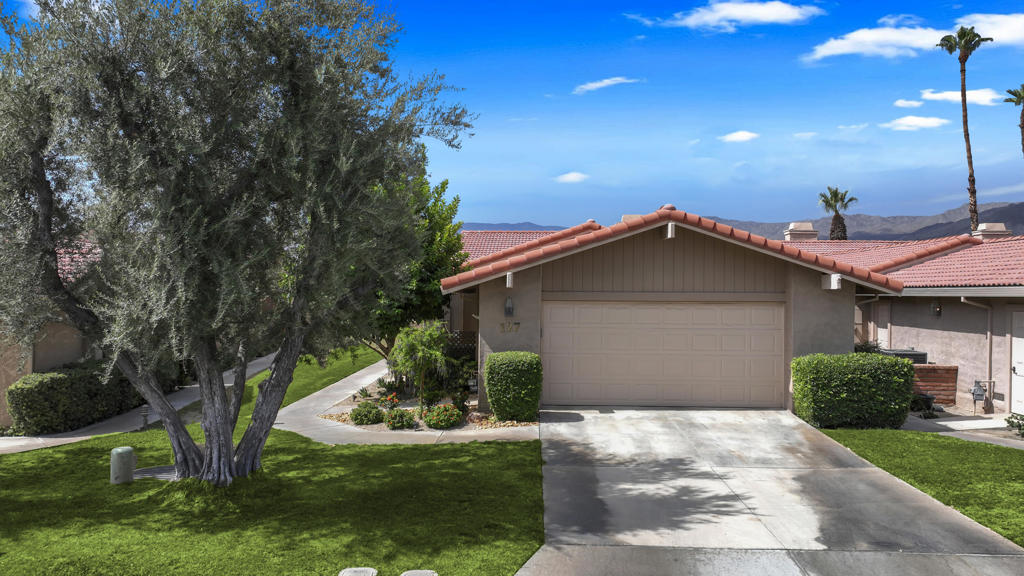 Welcome to The El Grande Plan - the perfect name for this Top to Bottom Remodeled Beauty; Ceilings raised to 9ft; perfectly enclosed atrium to create a third bedroom/family room with skylight, 2 murphy beds, office area and of course an ensuite bathroom with deep tub and stone surround. Views to the southern mountains through the enlarged kitchen window - over 9.5 feet long- and from the slab granite counter with easy seating for 4; top of the line appliances with below counter microwave (this kitchen bears no resemblance to original floor plan) - even an elevated TV . During the winter you'll enjoy the living room floor to ceiling stone fireplace. The Entire home has Tumbled Marbled Floors laid in the Versailles pattern. The Primary of course has a generous walk-in closet and the bath has a roll-in shower with dual controls, a seated make-up station and extended marble counters .The second guest bedroom has its own bath again with marble counters, shower with dual controls and large seat. Laundry area has double door closet for additional storage and direct access to garage. Back patio has beautiful southern views and BBQ area as well as covered seating for ''many'' and outdoor TV and mounted patio heater. The adjacent wide and partially enclosed lawn area makes you feel you have your own private yard - for pets, children, or private sun bathing. For those who have never lived on a golf course, we guarantee you won't miss the sound of lawn mowers or golfers. Chaparral Country Club is the perfect size - 625 homes (Guard Gated ) for a friendly social club part time or full time living. Its Chef is famous for great food and its executive 18 hole par 3 golf course has lakes and sand traps to challenge the best players. The most fashionable golfer will find the Pro shop good shopping. Currently there are 8 lighted pickleball courts with 4 more on the way as well as a Certified Pickleball Pro. plus 3 lighted tennis courts and a fully equipped fitness center ; 21 pools & spas,- even a small library Something for everyone -- if you are a good poker player you might like the regular games. Make time to see this exceptional deal -- seller moving closer to family - it's even better in person than the pictures. Buyers to pay $5000 at closing for Capital Reserve Fund. Special Assessment of $100/mo as of 7/1/2025 to Country Club.