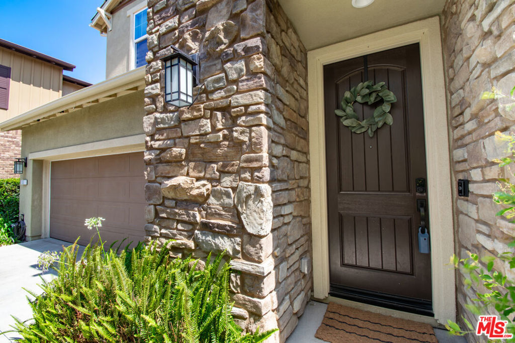 Prime 4-Bedroom Living with Panoramic Mountain Views in Rancho Mission Viejo! Welcome to 50 Fosco Street, a standout residence in the coveted Aria neighborhood of Rancho Mission Viejo. This expansive Plan 3 layout, the largest in its collection, was built in 2018 and thoughtfully upgraded for elevated everyday living. With 4 bedrooms plus a loft, including a convenient main-level suite, it's the ideal space for growing families, multigenerational living, or those working from home. What makes this property exceptional:Newly added solar panels generating income and keeping energy bills lowTankless water heater, water softener, and upgraded epoxy garage flooring with storageGorgeous luxury vinyl plank flooring, custom lighting, and designer finishes throughoutStunning mountain views from multiple windows and a sun-filled backyard retreatThe open-concept kitchen is a chef's dream with upgraded Caf appliances, white shaker cabinetry, quartz countertops, a custom desk nook, and an oversized island for gathering. Step outside to a fully finished backyard complete with a built-in fireplace, shade umbrella, outdoor TV, and spectacular hillside vistas.Upstairs, enjoy a spacious primary suite, two additional bedrooms with a Jack-and-Jill bath, a generous loft, and a well-appointed laundry room.Located in the award-winning Esencia K-8 school zone and moments from world-class community amenities resort-style pools, fitness centers, parks, farms, sports courts, trails, and more this home truly delivers the best of California lifestyle living.