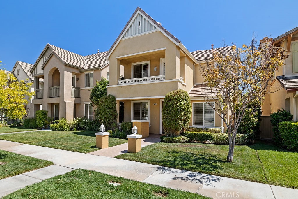 Tucked away on a quiet cul-de-sac in Valencia’s coveted Creekside community, this beautifully updated home combines modern comfort with timeless design in one of the area’s most desirable settings. Set back from main streets, the location offers a sense of privacy and tranquility while keeping you close to the paseos, pools, shopping, dining, and award-winning schools that make Creekside so beloved.
Inside, the home immediately impresses with its open, light-filled layout. Wide plank wood-look flooring and classic wood shutters create a warm, cohesive backdrop that flows easily from one space to the next. The living room, framed by abundant windows and anchored by a welcoming fireplace, sets the tone for both everyday living and entertaining. Just beyond, the dining room makes a striking statement with a full wall of custom-built-in bookshelves; equally suited for showcasing a library collection as it is for creating a memorable setting for family gatherings and dinner parties.
The kitchen has been thoughtfully appointed with expansive granite countertops, stainless steel appliances, and ample cabinetry for storage. A raised breakfast bar keeps the space connected to the living areas, while an adjacent coffee bar with quartz accents and custom wood cabinetry offers both function and flair—an everyday luxury that makes mornings and evenings feel just a little more special.
Upstairs, three spacious bedrooms provide room for everyone, including an expansive primary suite that serves as a true retreat. Complete with a private balcony, dual vanities, soaking tub, and separate shower, the primary suite elevates daily routines into moments of relaxation. A practical upstairs laundry room adds convenience, making everyday living effortlessly simple.
Outdoors, the private backyard extends the home’s open flow, offering a welcoming space for barbecues, al fresco dining, or simply enjoying Valencia’s year-round sunshine.
With thoughtful updates, curated details, and an unbeatable location on a cul-de-sac away from through traffic, this home captures the very best of Creekside living: open, connected, and designed for both comfort and community.