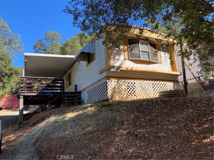Two bedroom, one bathroom manufactured home situated on its own private lot, could be an investment opportunity! The home features an open floor plan, great natural lighting, updated kitchen cabinets, and a large deck outside of the living room. The partially fenced large lot offers nice sized area for gardening, with a shed for added storage.