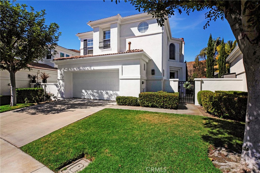 Welcome to this stunning 3-bedroom plus office, 3-bathroom home nestled in the gorgeous gated community of San Juan Hills. With one of the best lots in the community this home has lake, golf course and hills views. The open-concept floor plan is bathed in natural light, creating a warm and inviting atmosphere throughout. The spacious kitchen features an oversized island with soft close drawers, a walk-in pantry, and abundant storage, making it perfect for both everyday living and entertaining. It seamlessly flows into the cozy family room, complete with a gas fireplace and built-in shelving. Formal dining room has custom wine rack and there is also a custom wrought iron staircase to take you upstairs. Upstairs, you'll find three well-appointed bedrooms, plus a versatile loft area. The primary suite is a peaceful retreat, offering a private Juliette balcony that overlooks the tranquil outdoor space. Step outside to a serene patio and beautifully landscaped garden with fountain and gazebo overlooking the golf course and lake ideal for relaxing or hosting al fresco dinners with plenty of space for guests. This home effortlessly combines comfort, style, and functionality, making it an ideal place to call your own. This home is centrally located to dining, shopping and freeway close, minutes to the beach and offers an array of recreational activities including hiking in the beautiful surrounding hills. This home is a must see and will not last!