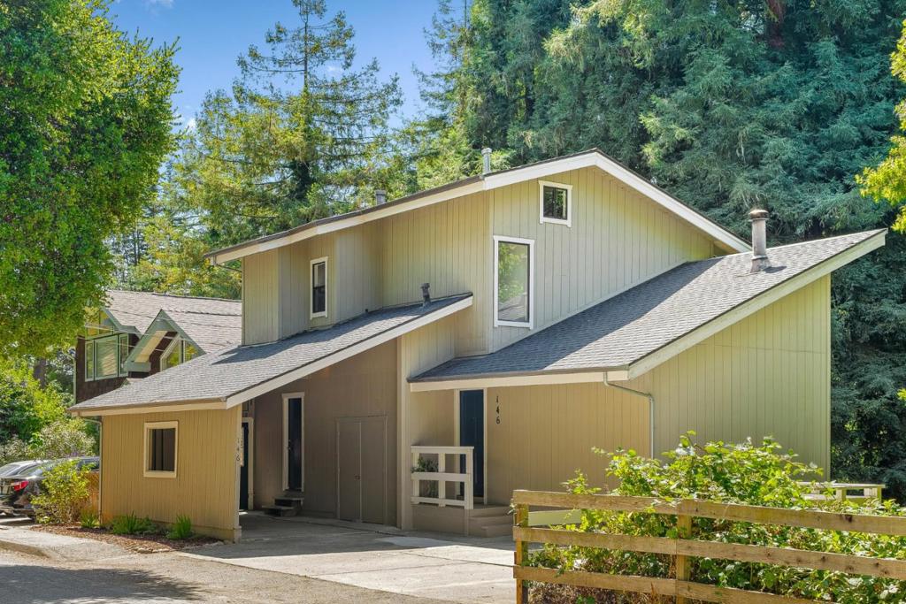 Redwood Views & Coastal Living in the Heart of Aptos. Surrounded by lush greenery & framed by majestic Redwoods, this home offers a peaceful living experience featuring a sunny & thoughtfully designed living space w/vaulted open beam ceilings, lg. windows which fill the home w/natural light & a potbelly stove bringing warmth & charm to the open-concept layout. The living room, dining room & kitchen flow together creating a comfortable space for everyday living & entertaining. Sliding doors lead to a spacious back deck, perfect for outdoor dining, relaxing among the trees & enjoying the fresh coastal air. Both bedrooms are located upstairs, offering privacy & peaceful treetop views. A carport & ample off-street parking provide everyday convenience. The location is a true highlight, just a short distance from Aptos Village with its local shops, restaurants & New Leaf Market and close to favorite spots like Cat & Cloud Coffee, Rio Del Mar Beach & the trails of Nisene Marks State Park. Desirable Aptos Schools! Easy access to Highway 1, commuting to Santa Cruz, Monterey or San Jose is a breeze. Whether you're searching for a full-time residence, weekend getaway or investment property in a highly desirable coastal community, this home delivers a perfect balance of comfort & nature!