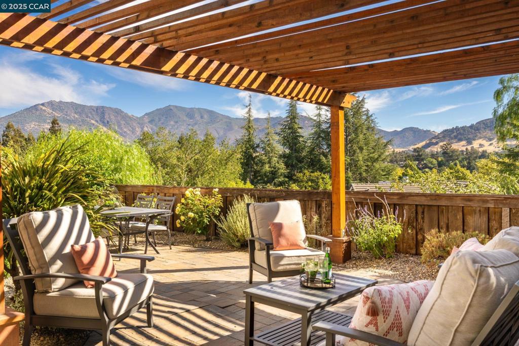 Breathtaking Mt. Diablo Views – Your Private Paradise Awaits From the moment you step inside, the sweeping Mt. Diablo views will take your breath away. This stunning end-unit townhome lives like a private retreat, with walls of windows framing the natural beauty from nearly every room. Outside, a beautifully landscaped wrap-around yard invites you to sip a glass of wine under the pergola, or host unforgettable gatherings on the patio. It’s the perfect blend of elegance and tranquility—your own private paradise. Inside, the remodeled kitchen shines with sleek stone countertops and stainless steel appliances, opening to the family room where natural light pours in. The living room, also designed to showcase the views, creates the ideal backdrop for both entertaining and everyday living. Upstairs, the spacious primary suite feels like a getaway with dual closets, dual vanities, and a large picture window framing Mt. Diablo. Two additional generous bedrooms provide space for family, guests, or a home office. And when you’re ready for a swim, the community pool is just moments away—offering the luxury of resort-style living without the maintenance. Don't miss the opportunity to make 931 Arrowhead Terrace home!