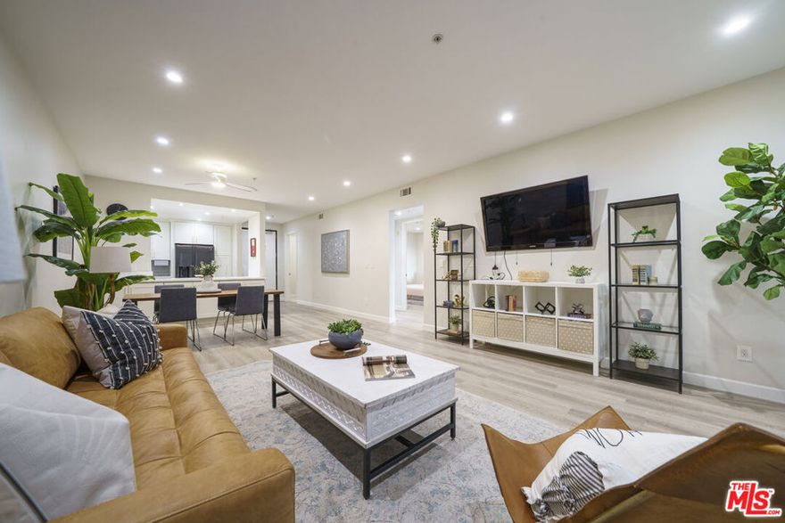 REMODELED! Located in the heart of Koreatown on one of the neighborhood's busiest and most vibrant streets, this fully remodeled 2-bedroom, 2-bathroom condo offers the perfect blend of comfort, style, and convenience. The spacious, light-filled unit features high ceilings, an open-concept living area with a cozy fireplace, and brand-new kitchen appliances complemented by modern flooring throughout. Enjoy the ease of in-unit heating, air conditioning, washer and dryer, and a digital door lock for added security. The home also includes a large separate storage area and two tandem underground parking spaces. Residents benefit from secured building access with 24-hour on-site security, package reception, a fully equipped fitness center, and ample guest parking. Step outside and experience Koreatown's best dining, shopping, and entertainment options just steps awaypopular spots like Oko Bing, Seong Buk Dong, Chapman Plaza, and H-Mart are all within walking distance, along with the Vermont/Wilshire Metro station for easy access to Downtown LA and USC. Combining modern upgrades, prime location, and exceptional amenities, this move-in-ready home delivers the ultimate Koreatown lifestyle where convenience meets contemporary living.