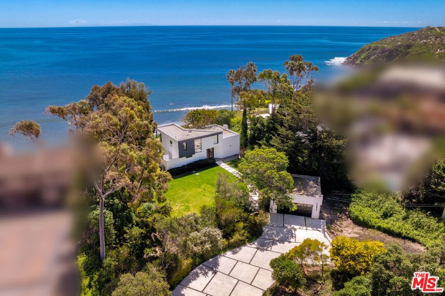 Located on the front row of the priciest street of Point Dume! This is one the last opportunities to either build your own dream estate - comes with plans by renowned architect Brian Biglin to build  6 bed/6.5 Bath spreading on nearly 7000,sft- or to just move in this cozy, yet completely remodel Retreat offering 2 bed/2.5 bath with the possibility to expend and add sft if desired.  Nestled on nearly one acre, this exceptional Point Dume compound boasts sweeping views of the ocean, Catalina Island, and the iconic "Queen's Necklace" sparkling at night. Located behind gates on one of Point Dume's most coveted streets, the property offers unmatched privacy and is one of the rare few with private beach stairs leading directly to the white sands of Dume Cove. opportunity to either build your own dream estate - comes with plans by renowned architect Brian Biglin to build  6 bed/6.5 Bath spreading on nearly 7000 sft- or to just move in this cozy, yet completely remodel Retreat offering 2 bed/2.5 bath with the possibility to expand and add sft if desired. A long driveway and charming garden path lead to the two-story open-concept living with panoramic Views, high ceiling, dining, and kitchen areas are bathed in natural light and flow seamlessly to the backyard, framing the dramatic ocean backdrop. The expansive outdoor spaces are perfect for entertaining, dining under the stars, or even whale watching. The lush front lawn, beautifully landscaped with mature trees, provides the ideal setting for gatherings, lounging, or a children's play area. Behind the gates, a detached two-car garage and generous driveway parking add convenience and security.