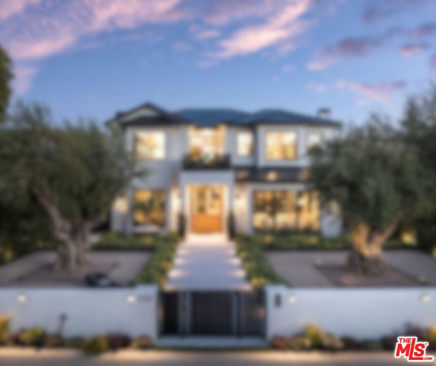 Welcome to 210 Marguerita Avenue, the finest North of Montana offering to ever hit the market. This brand new transitional modern masterpiece features impeccable materials and craftsmanship, is replete with luxurious amenities, and is perfectly sited on one of the most coveted streets in Santa Monica. Beyond majestic old growth Olive trees you enter to find a welcoming, light-filled home with remarkably grand scale. Formal spaces including the elegant living room, home office, and dining room seamlessly flow to the more casual areas including the chef's caliber kitchen and family room with wet bar and dramatic fireplace. Up the graceful staircase or elevator you find a comfortable lounge which anchors the upper level. The grand primary suite is a peaceful haven with fireplace, spa-like bathroom, private balcony, and two expansive elegant walk-in closets reminiscent of posh designer boutiques. There are three additional bedrooms upstairs, a fifth bedroom on the main level, and a sixth bedroom on the lower level. The lower level is a proper entertainer's paradise with climate-controlled wine room, wet bar, second family room, large professional grade home theatre, spacious mirrored home gym, dry sauna, steam room with shower, and private massage room. Rounding out this coastal sanctuary is the sprawling rear yard with outdoor kitchen including a smoker and pizza oven, resort-like pool, relaxing patios and covered cabana, dedicated pool bathroom, and ample three car garage. Never before have you seen a home of this caliber in such a coveted location.