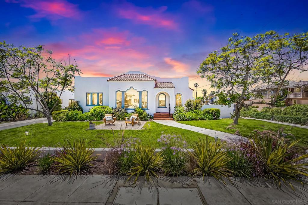 Looking for historic charm fused with modern convenience in one of San Diego’s most vibrant neighborhoods? Welcome home to 3692 31st Street. Nestled on a coveted corner lot in the heart of North Park, this 1926 Spanish-style residence is a rare blend of timeless architecture and thoughtful upgrades. Considering the Mills Act? This property is an excellent candidate. With arched entryways and original hardwood floors, every inch of this home radiates character and warmth—yet behind the walls, you’ll find updated electrical, copper plumbing, central HVAC, and a reinforced foundation for lasting peace of mind. The open-concept layout flows effortlessly from a sun-filled living room to a newly renovated, chef-inspired kitchen featuring Viking appliances. Two new, tastefully renovated bathrooms plus a spacious backyard with mature landscaping, gated access from Landis Street, plus an extra-long driveway that can easily fit four cars and leads to a detached garage with ADU potential. With a 96% proximity score, you’re just steps from North Park’s best coffee shops, restaurants, boutiques, Balboa Park and more. This isn’t just a home—it’s a historic work of art and a lifestyle rooted in culture and community.