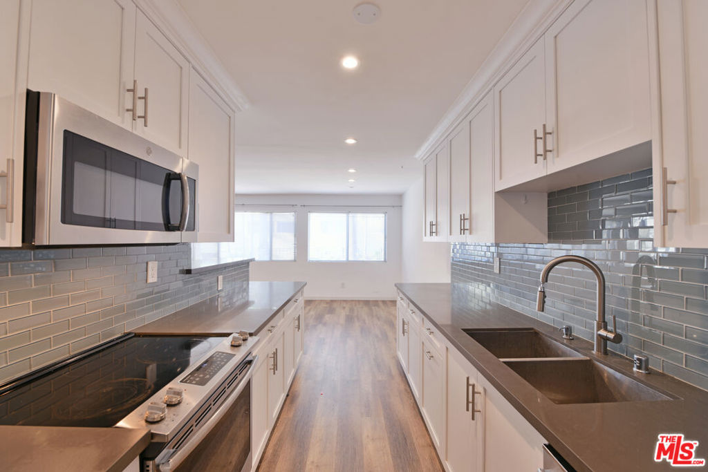 Beautifully Remodeled 2-Bedroom Apartment in the Heart of Beverly Hills! Step into this bright and stylish upper front corner unit, freshly remodeled and filled with natural light. Located in the prime Beverly Hills area, this 2-bedroom gem offers modern comfort and convenience. Enjoy a gorgeous kitchen featuring granite countertops, custom cabinetry, and stainless steel appliances. The unit also includes in-unit laundry, a rare and desirable feature for added ease.For added convenience, this apartment comes with 2-car subterranean parking, providing secure and easy access right beneath the building.