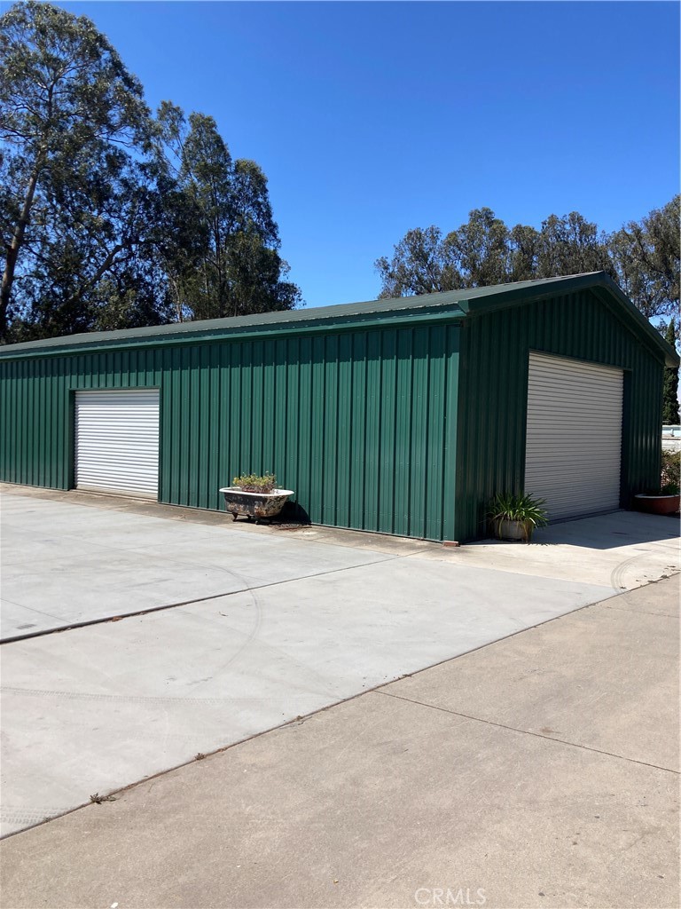 For the car enthusiast a large building accommodating 9 cars awaits you or, with the zoning being light industrial/manufacturing this could be utilized as a workshop or business. In addition, there is an ADU with a large kitchen partially divided to the main and only room functioning as a dual living/bedroom with a closet, bathroom with a walk in shower along with its' own private laundry facilities. It has its own private enclosed side yard with parking next to the unit. There is electricity and sewer connections on the dirt pad should you wish to add an additional trailer for additional income. This unique property offers a main 2 bedroom 1 bath home with double insulated North and West walls to reduce any noise level. An aviary accompanies the property but could function in a multitude ways such as a chicken coup. Solar is owned and only used for heating water to the spa. In a separate building the laundry room and a separate lavatory exists. A 10' x 12' structure with electricity could be used as a storage, craft, work or play room. There is ample space to expand to suit your needs. This is a rare opportunity in Arroyo Grande to run a small business and live on the property along with earning income as a supplement or rent both structures out while owning your own business property. All this is available and more! NOTE: The plot map shows the property to be over 40,000 sf. All information deemed reliable, however, buyer should do their own due diligence.