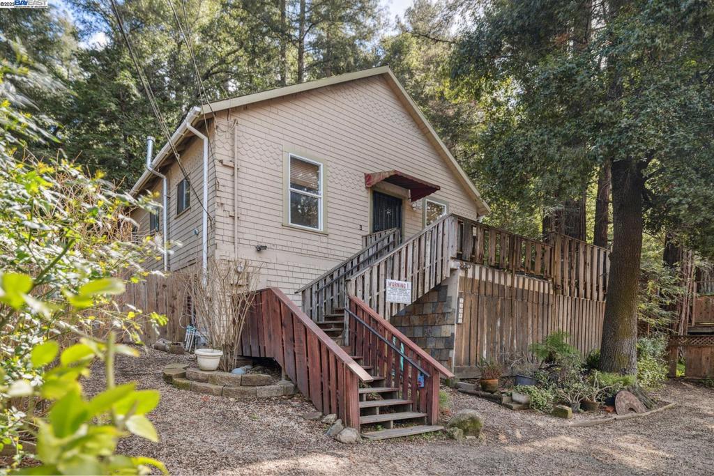 Tucked just behind the iconic Brookdale Lodge, this delightful 3-bedroom, 1-bath home is a warm retreat surrounded by majestic redwoods. Inside, hardwood floors bring timeless charm, while the kitchen boasts a newly installed gas oven for home chefs. The versatile downstairs area offers exciting potential—transform it into a studio for extra income or create a private space for guests. Step outside to the expansive wrap-around deck, ideal for summer BBQs, morning coffee, or simply soaking in the forest views. Perfectly situated between downtown Ben Lomond and Felton, you’ll have effortless access to local favorites like Aroma Restaurant, Emerald Mallard, and Mountain Feed & Supply.
