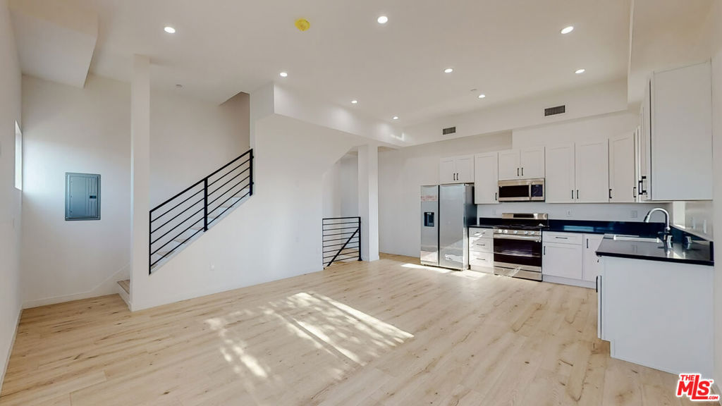 ** 1ST MONTH FREE PROMOTION - ONLY PAY SECURITY DEPOSIT AT MOVE-IN - SEE FULL DESCRIPTION ** PRIVATE ROOFTOP DECK ** PET FRIENDLY ** MODERN FINISHES ** IN-UNIT WASHER/DRYER ** CENTRAL A/C ** 3RD PARKING SPACE AVAILABLE ** The Cloverdale Townhomes redefine luxury rental living with the warmth and privacy of a true home, nestled in one of Los Angeles' most vibrant and central neighborhoods. Located at 1509 S Cloverdale Ave 1/2, this stunning 3-story residence sits at the heart of Mid-City, offering easy access to Beverly Hills, Miracle Mile, Culver City, and DTLA, placing you minutes from the best of L.A.'s dining, shopping, and cultural hotspots. Each townhome is thoughtfully designed for the modern renter, featuring expansive open layouts with soaring 11-foot ceilings throughout, flooding the interiors with natural light from oversized windows. Take in sweeping views of the city skyline and the iconic Hollywood Sign from your private rooftop deck, perfect for relaxing or entertaining. Inside, you'll find a generously sized 4-bedroom layout, rooms complete with its own private en-suite bath and spacious closets. The home also includes a built-in washer and dryer, a Nest-controlled central air and heat system (zoned by floor), sleek stainless steel Samsung appliances, custom cabinetry, designer wood floors, elegant quartz countertops, and premium fixtures by Kohler and Moen. Whether you're working from home, hosting friends, or enjoying the walkability and energy of Mid-City, The Cloverdale Townhomes deliver an unmatched combination of space, design, and location. ** 1ST MONTH FREE PROMO - PRICE REFLECTS PROMOTION OVER 12 MONTHS - BASE RENT $5,100 **