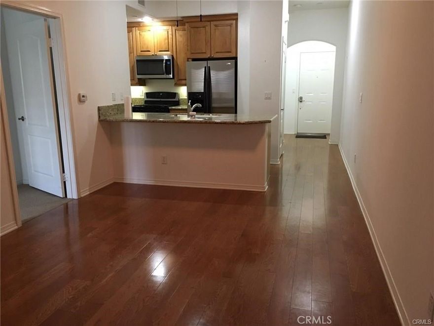 55+ Senior Community of Breakwater Village. This condo is in pristine condition, The kitchen comes complete w/stainless steel appliances. High end finishes include granite counter-tops in the kitchen and bathrooms. Hardwood flooring grandfathered in, HOA no longer allowing newly installed hardwood. and tile throughout. Walk in closet, laundry inside, A/C, refrigerator, washer and dryer included. Community Room with a state of the art gym, pol, outdoor fireplace and BBQ to enjoy.